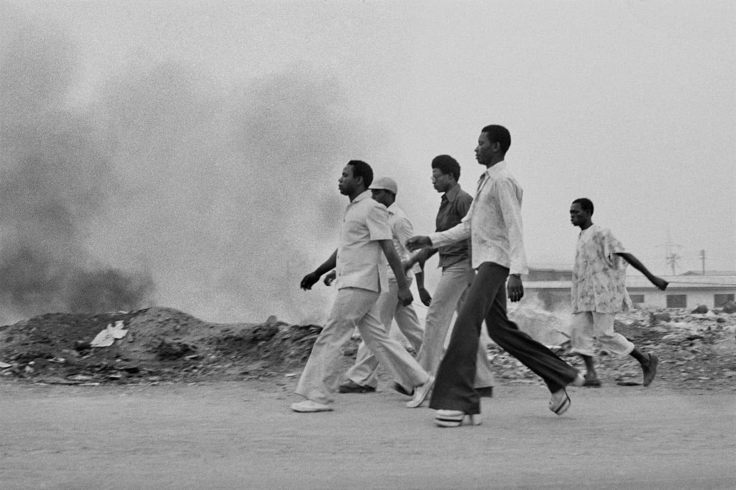 A group of men walking at FESTAC ’77. Copyright: Marilyn Nance / Artists Rights Society (ARS), New York.