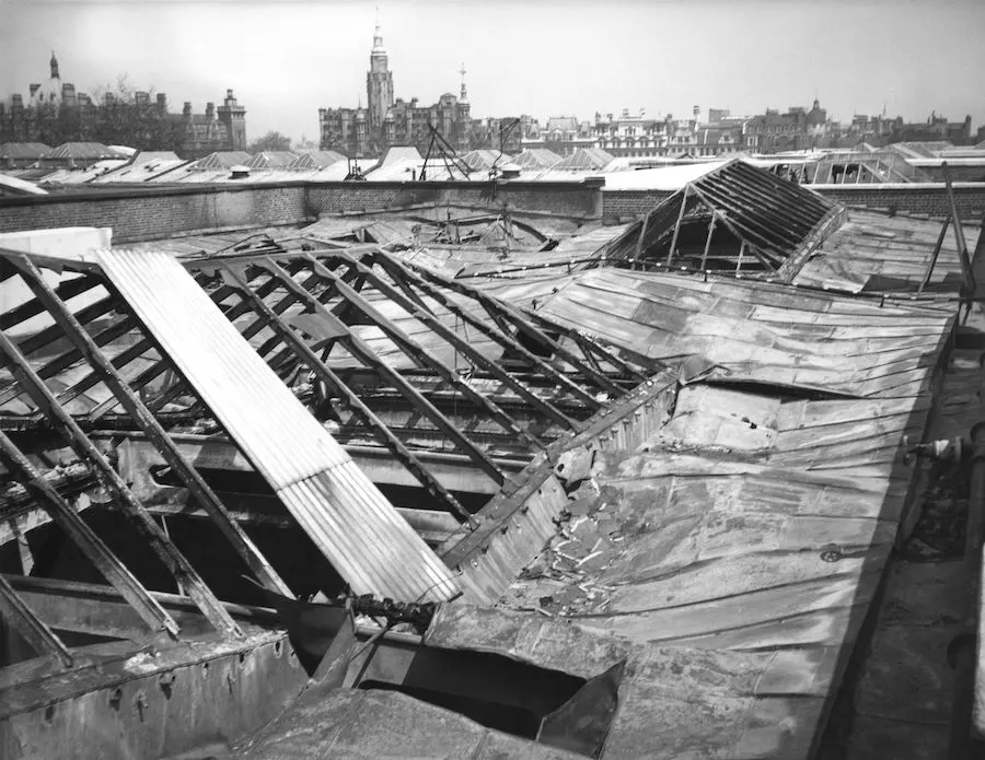 A black and white photo of a roof that has been torn down.